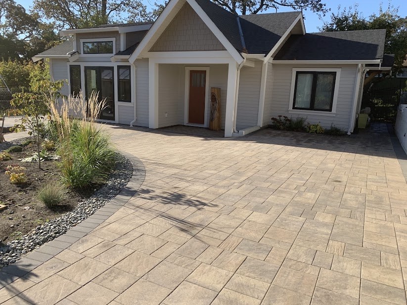 Finished Coastal Slate paver driveway with a curved garden border