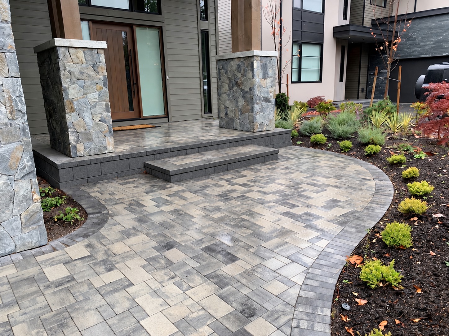 Curved interlocking paver entrance with contrasting border